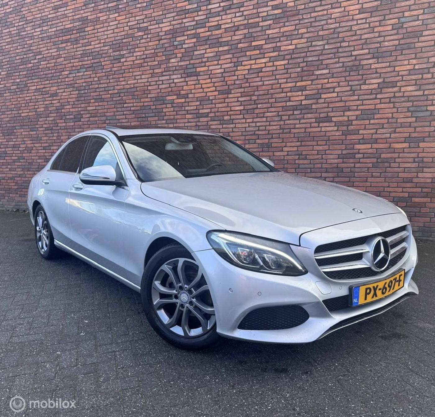 Mercedes-Benz C-klasse 180 Ambition Led Dak Stoelverw NL auto AMG 2016 - voorkant