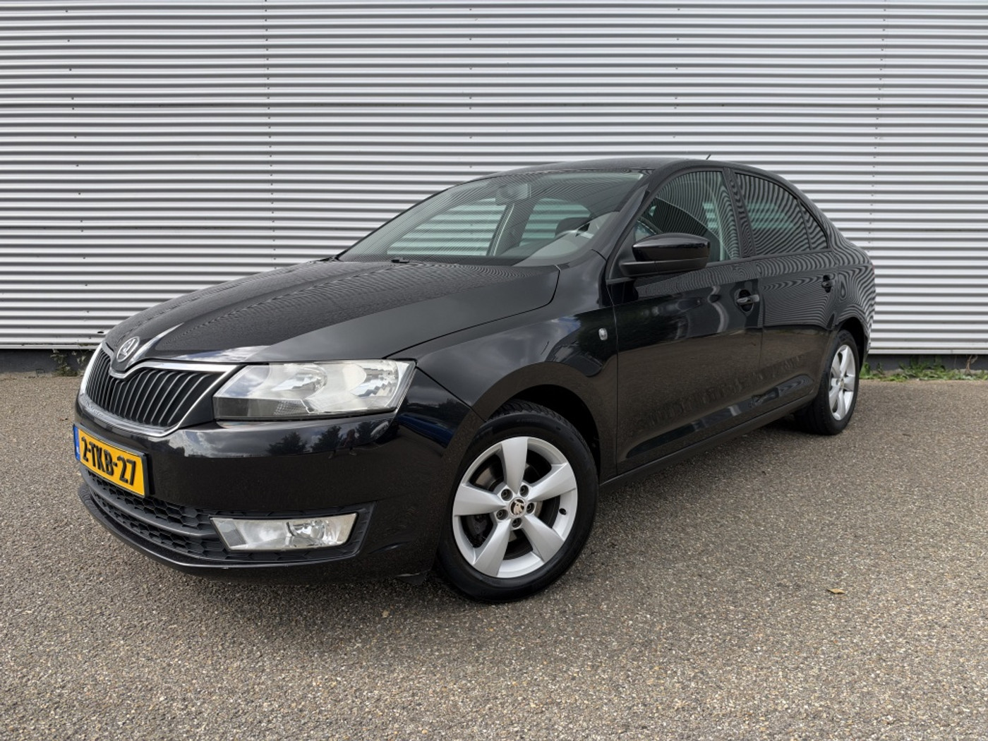 Skoda Rapid 1.2 TSI Grt Amb Bns NAP Cruise Airco Navi PDC 15" lichtmetaal 2014 - voorkant