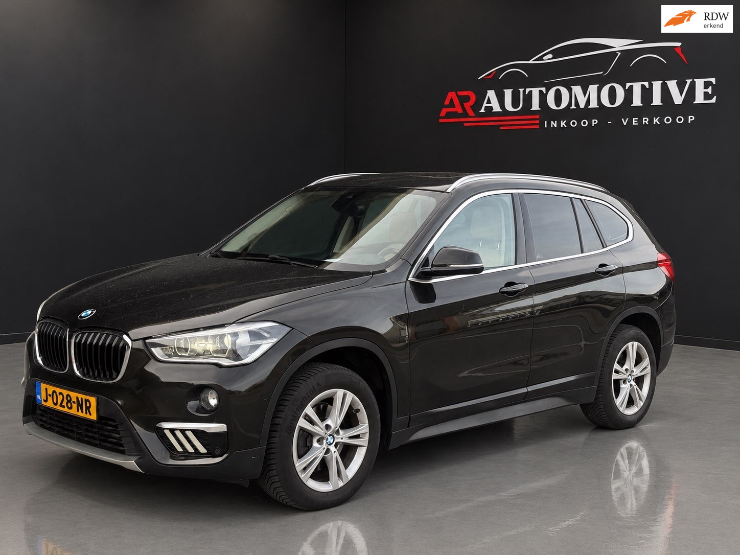 BMW X1 Sdrive18i SDrive18i Centennial High Executive / Panoramadak / APK 2016 - voorkant