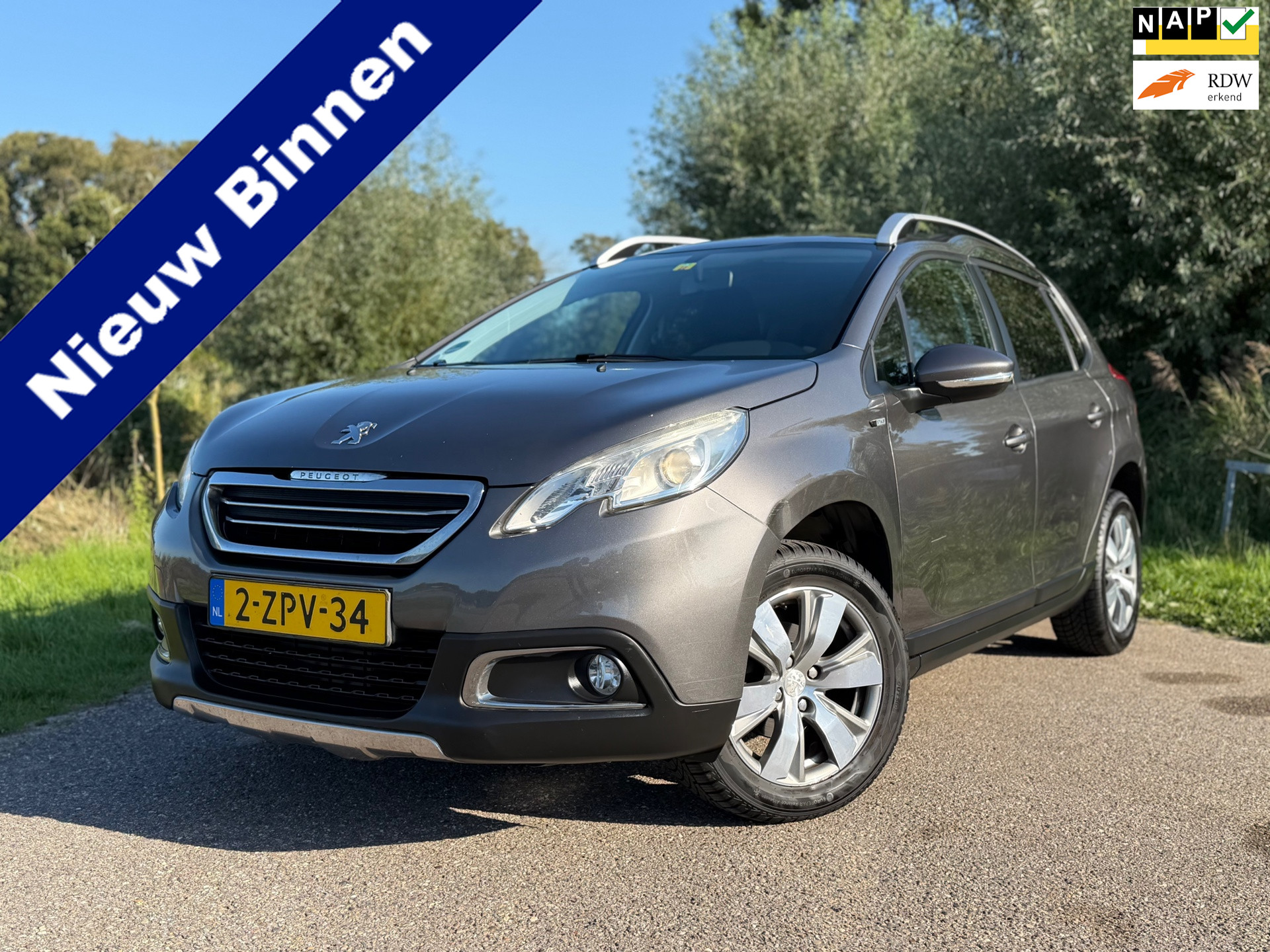 Peugeot 2008 1.2 PureTech Style / Automaat / Nieuwe distributieriem 11-2025 / Navigatie / Climate Control 2015 - voorkant
