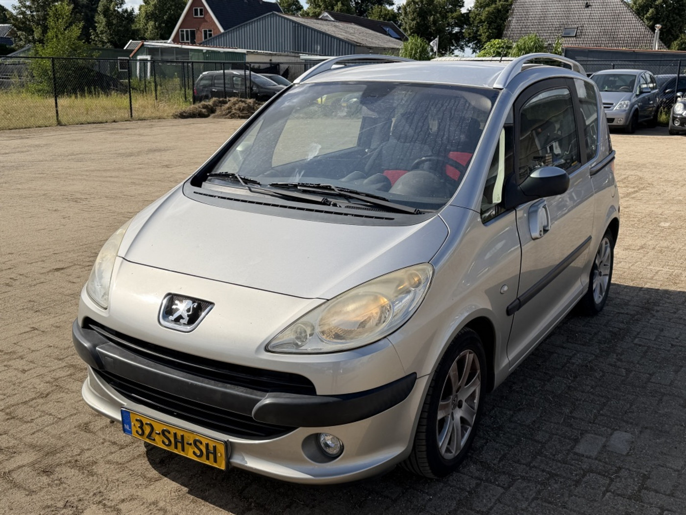 Peugeot 1007 1.4 Gentry| GRIJS| 167DKM NAP| CLIMA| CRUISE| LM 2006 - voorkant