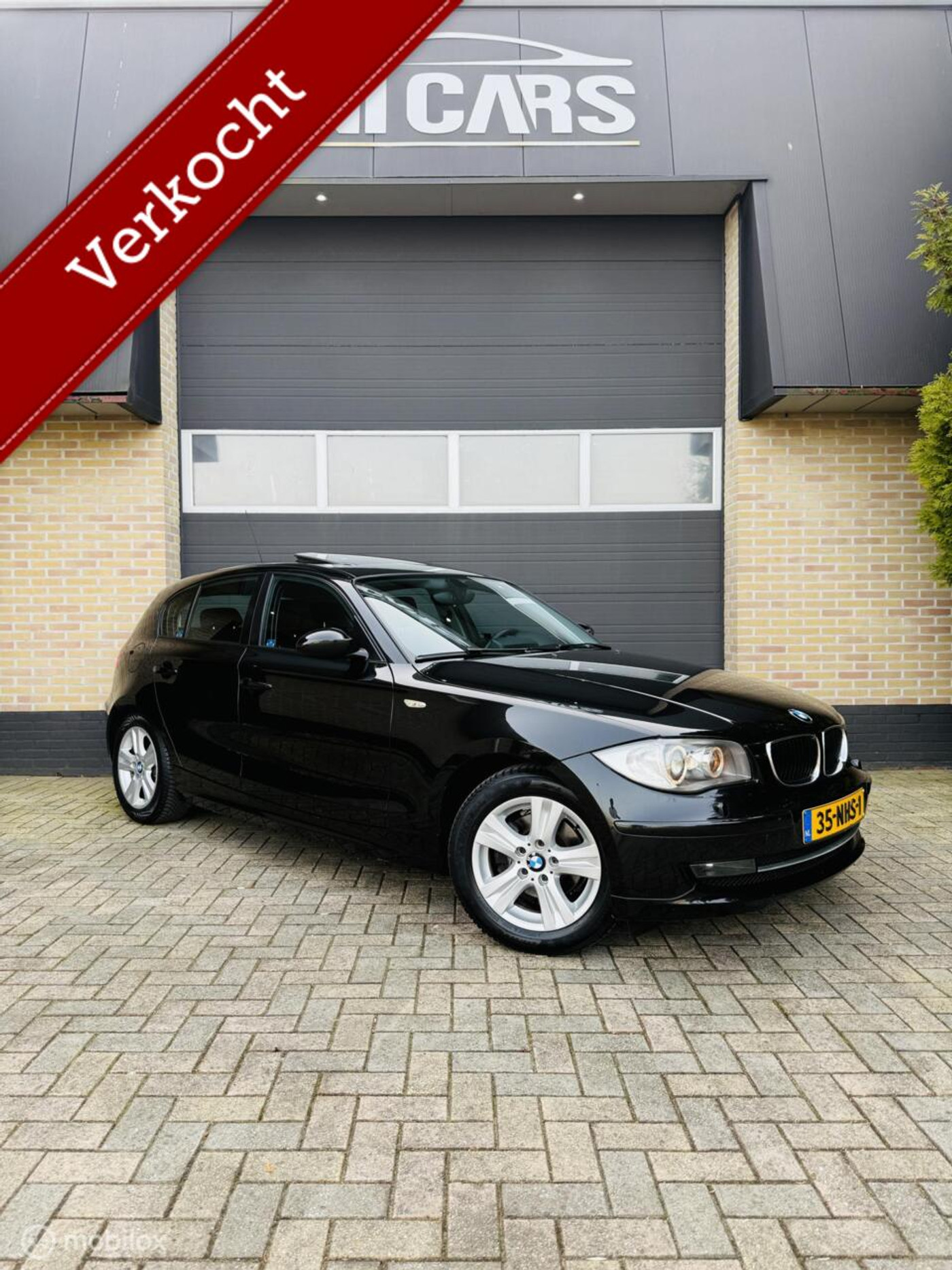 BMW 1-serie 118i Executive|Automaat|Opendak|Navi|Xenon|LM 16 2009 - voorkant