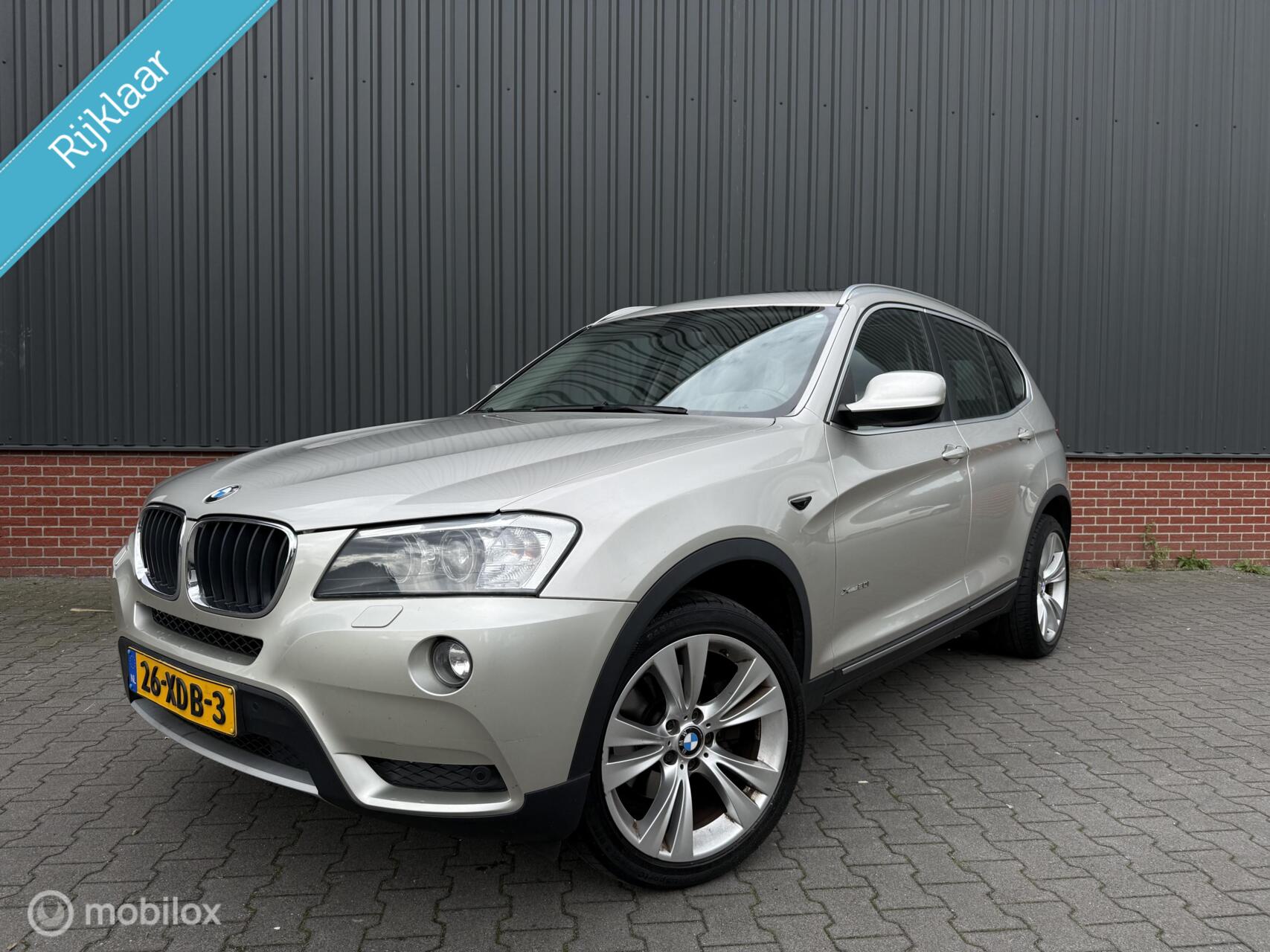 BMW X Reihe xDrive20i High Executive Aut Panorama Xenon Cruise Leder Trekhaak NL Auto 2012 - voorkant