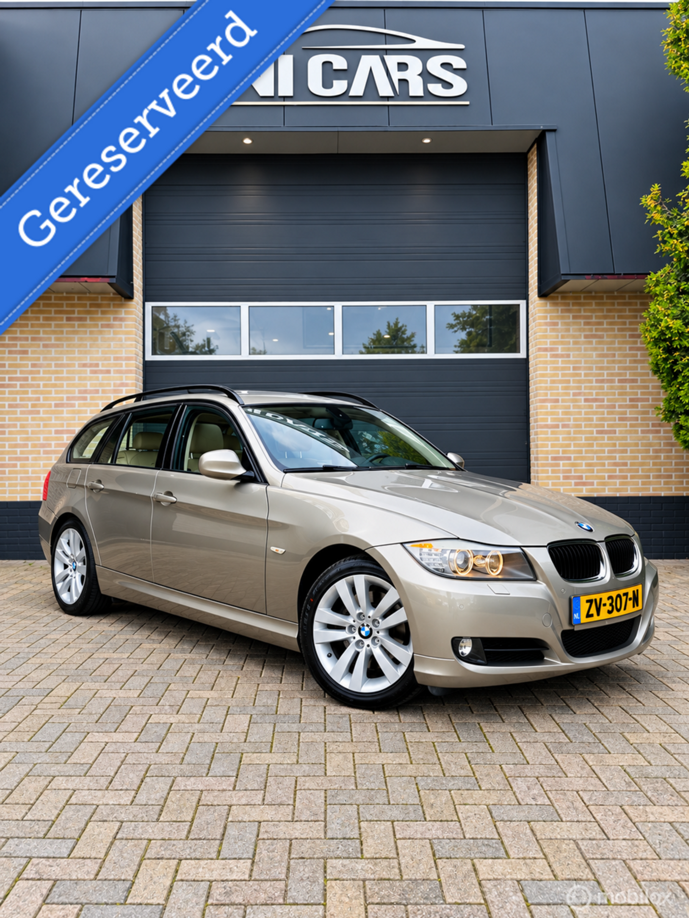 BMW 3-serie Touring 320i 2009 - voorkant