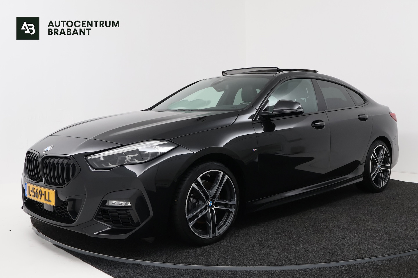 BMW 218i 218i Business Edition Plus (PANORAMADAK, CAMERA, SFEERVERLICHTING, STOELVERWARMING, PARKEERSENSOREN) 2021 - voorkant