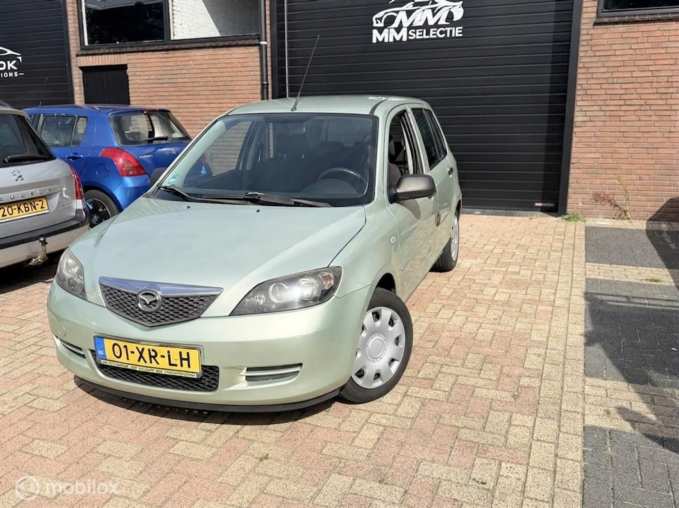 Mazda Mazda 2 1.4 Exclusive | NAP | 159.427 km | Airco | Trekhaak 2007 - voorkant