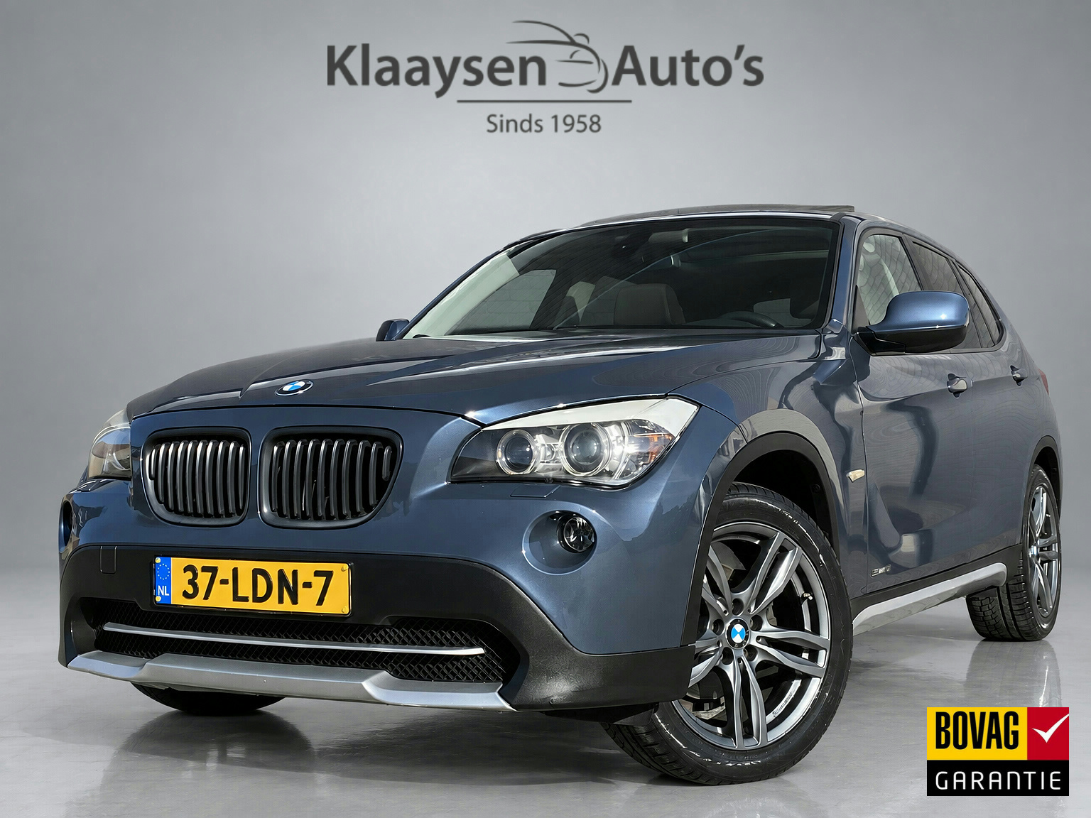 BMW X1 sDrive 18i sDrive18i Executive AUT. | navigatie | panoramadak | sportstoelen | xenon verlichting | lichtmetalen velgen 18 inch 2010 - voorkant