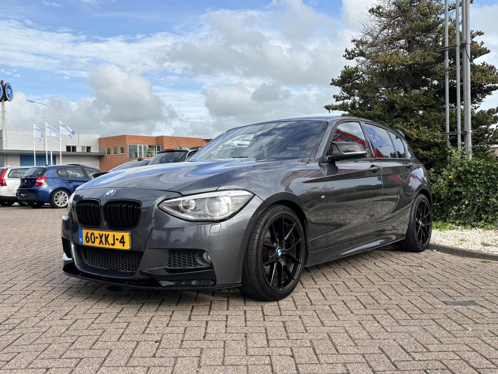 BMW 1-serie 118i 2012 | M-sportpakket | Mineral Grey 2012 - voorkant