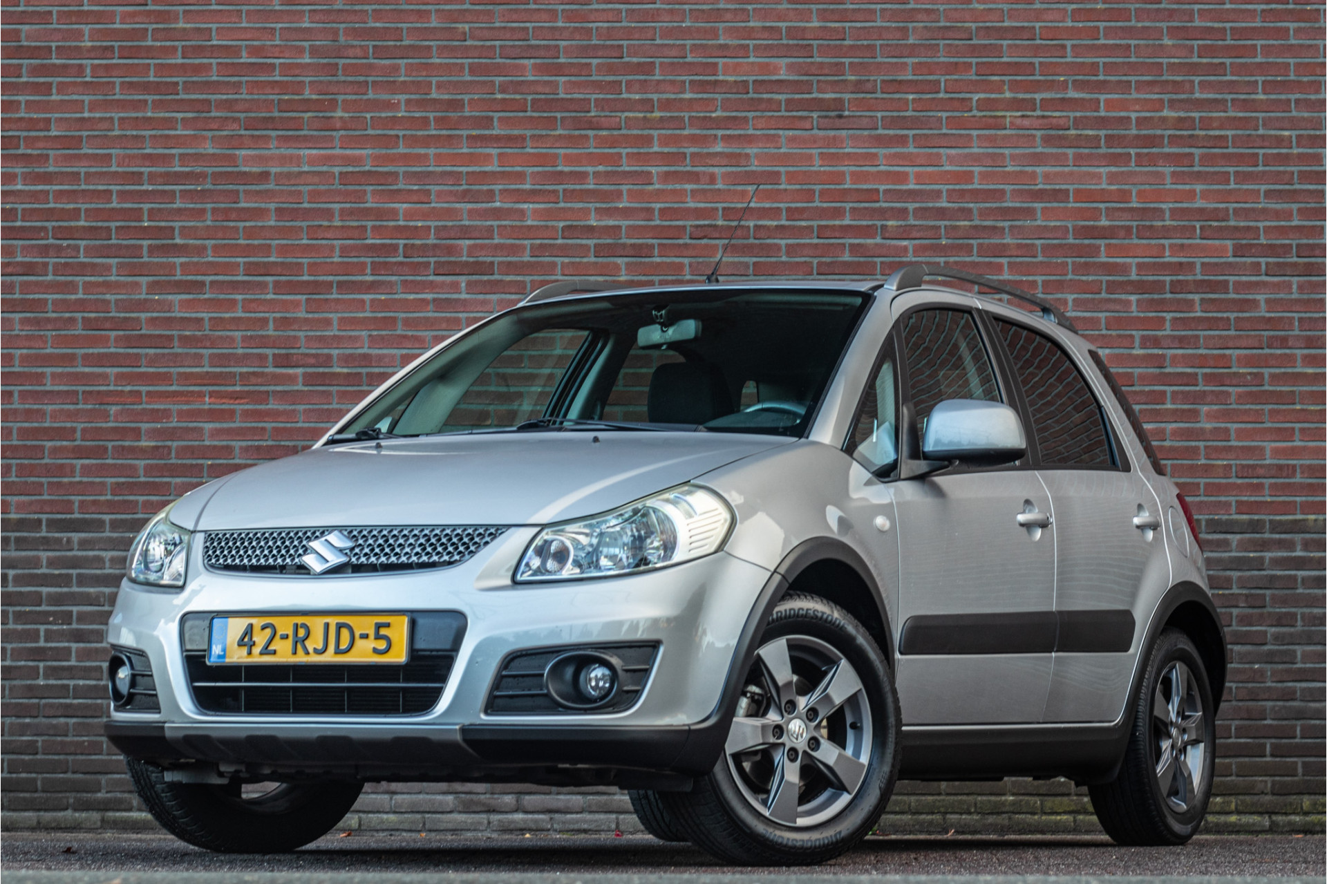 Suzuki Sx4 1.6 Limited, 2e eigenaar, 76.000km NAP, Alcantara, Trekhaak, Climate control. 2011 - voorkant