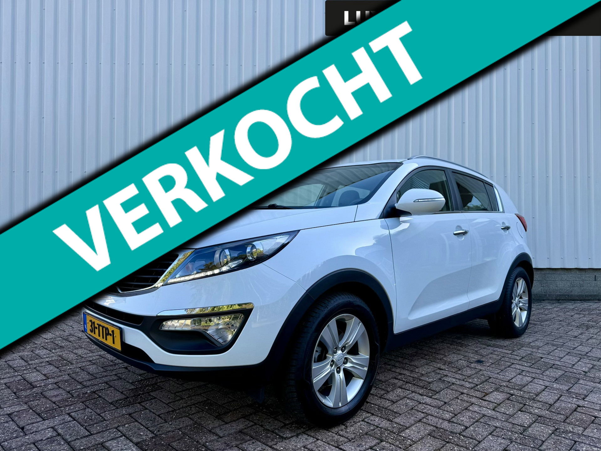 Kia Sportage 1.6 GDI X-ecutive Plus Pack, 1e eigenaar Clima, PDC, 4-seizoenenbanden, NAP 2012 - voorkant